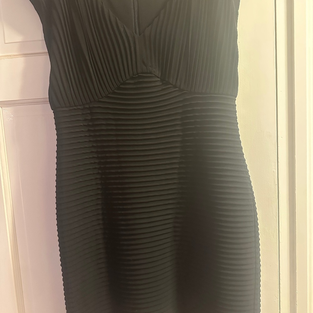 Never worn black dress by Calvin Klein. Size 14
